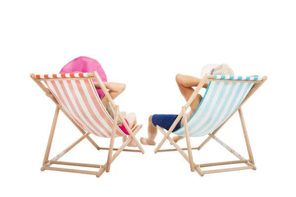 Happy Couple sitting on beach chairs isolated on white — Stock Photo, Image