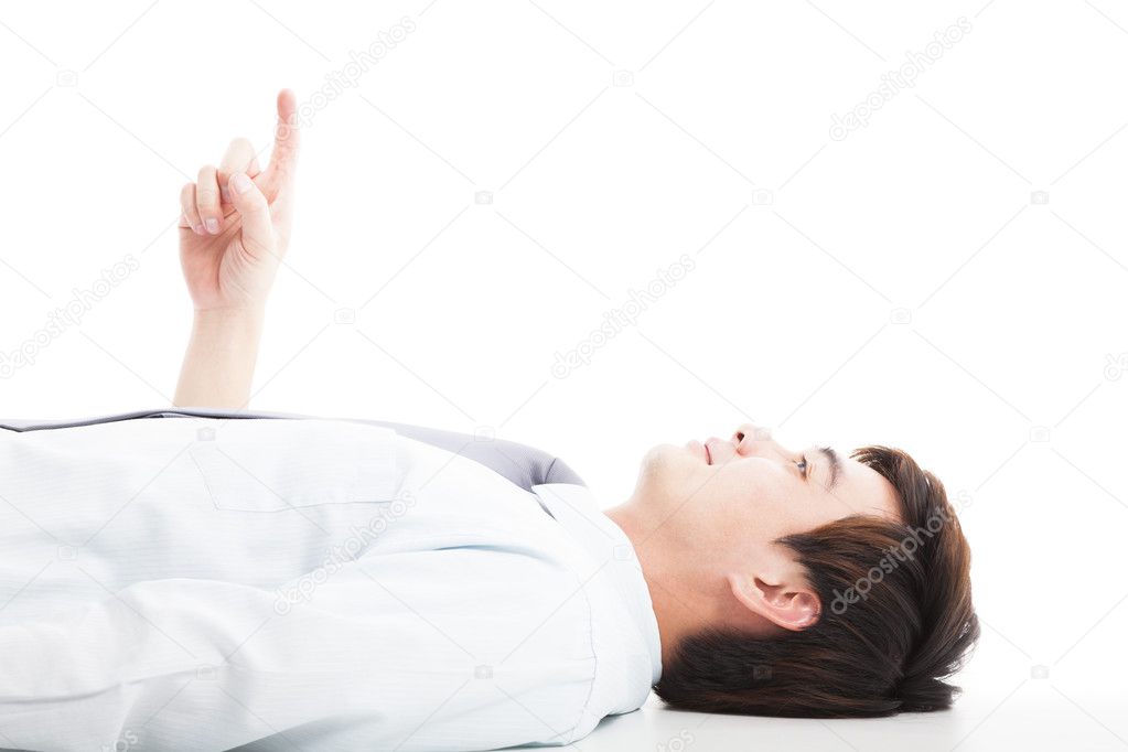 relaxed businessman lie down and pointing up
