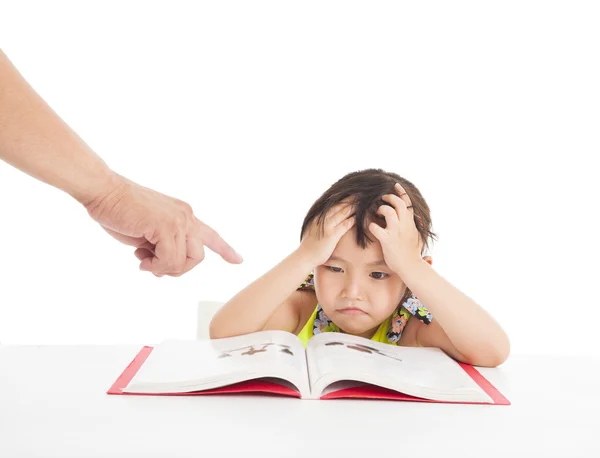 Finger pointing to Angry and tired little girl studying — Stock Photo, Image