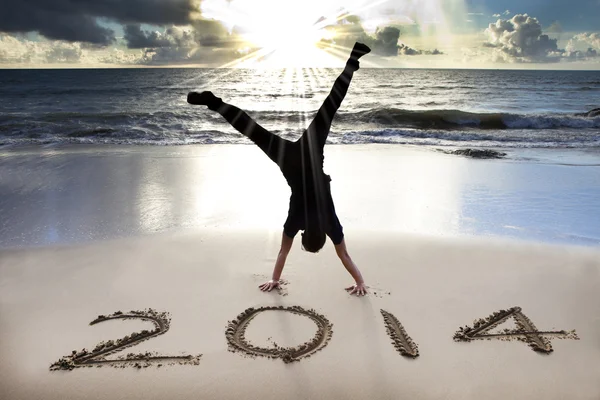 Happy new year 2014 on the beach with sunrise — Stock Photo, Image