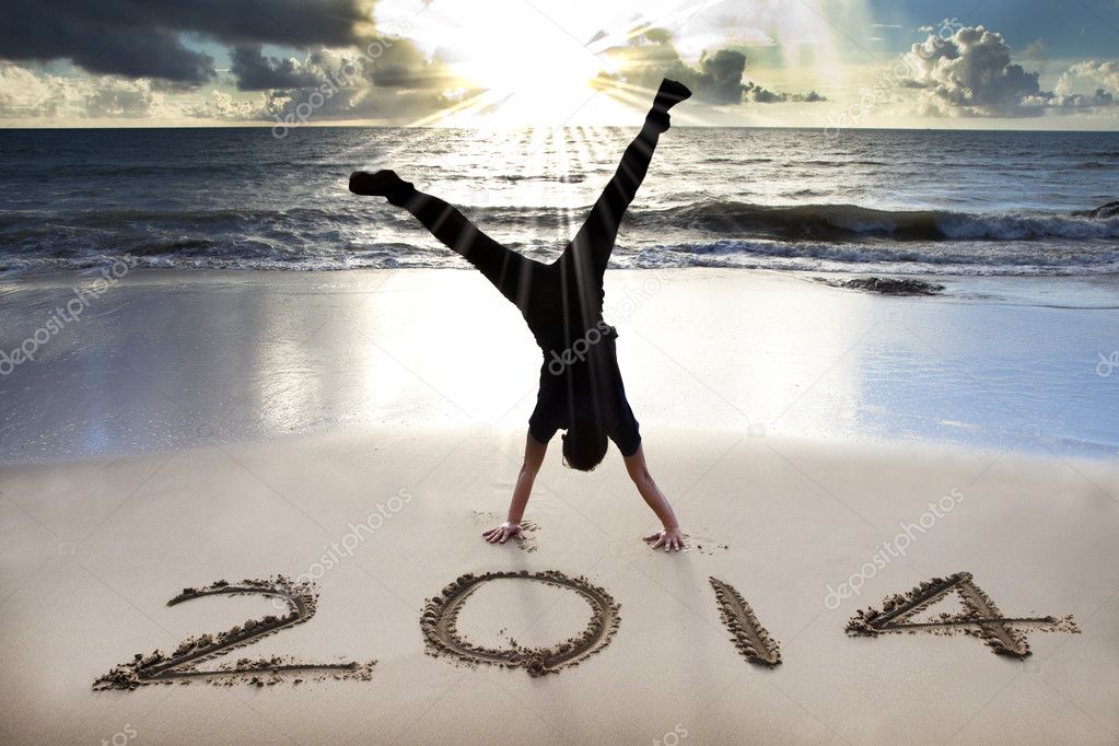 happy new year 2014 on the beach with sunrise