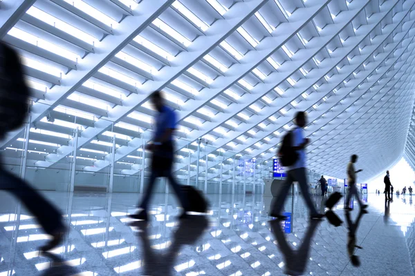 Motion blurred commuters At the airport — Stock Photo, Image