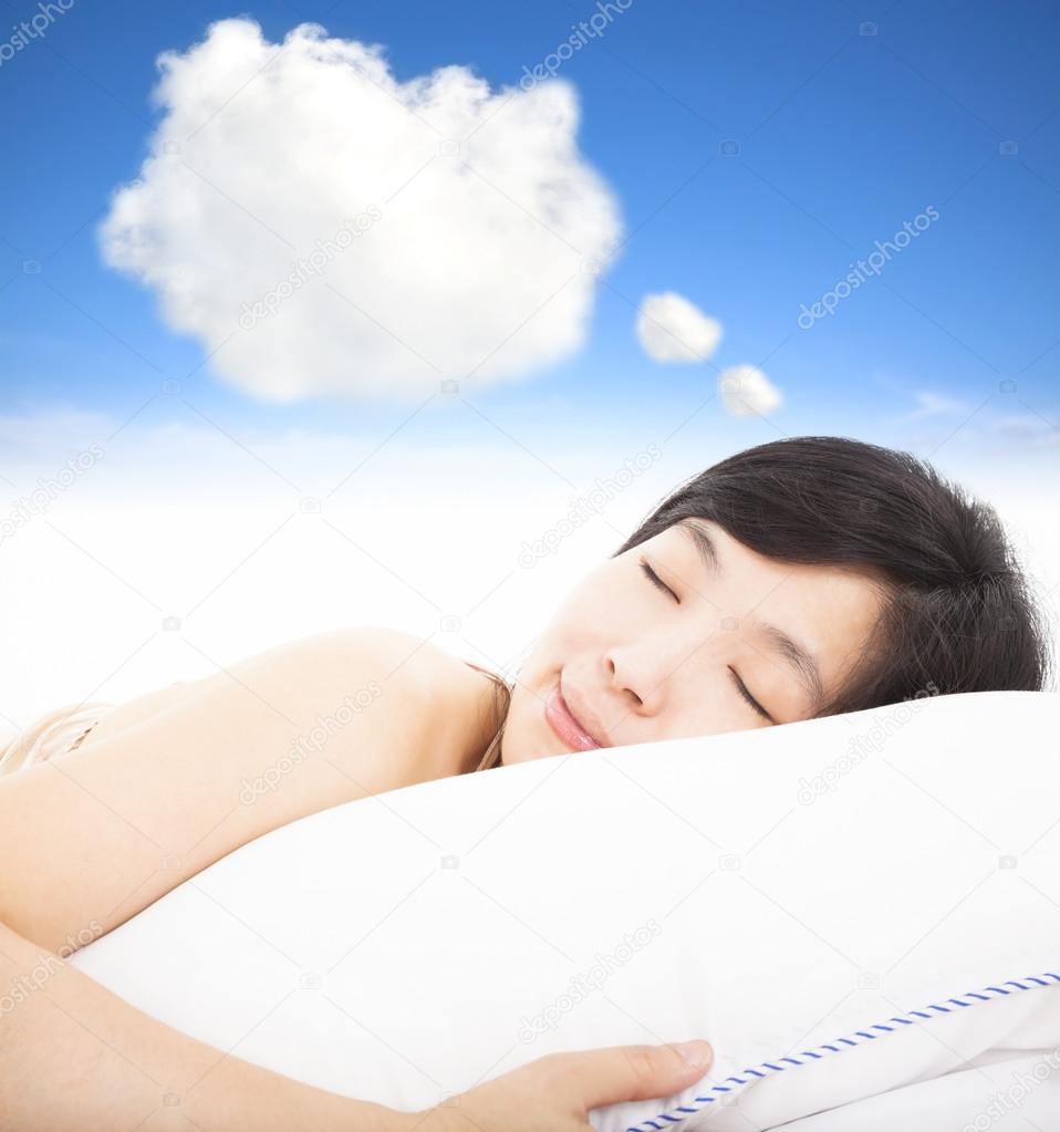 smiling and sleepy woman with dreams cloud sign