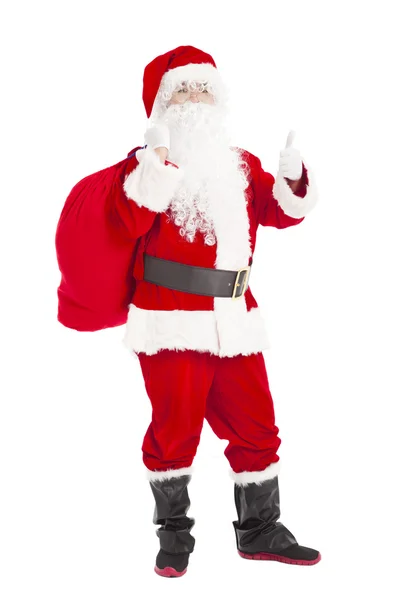 Merry christmas santa claus geschenk tas met de duim te houden — Stockfoto