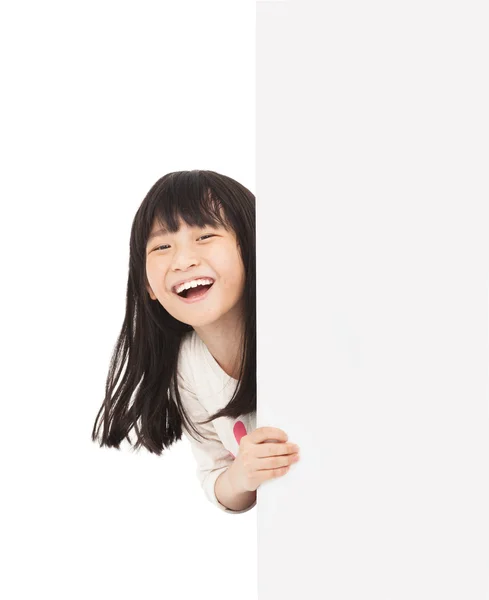 Mutlu küçük kızın arkasında bir beyaz tahta — Stok fotoğraf