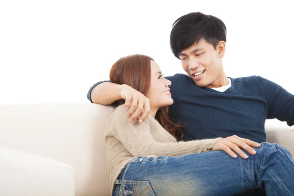 Young couple on the sofa in love — Stock Photo, Image