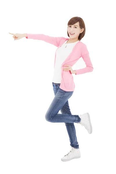 Happy young woman showing something to side — Stock Photo, Image