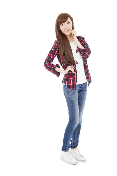 Full length happy young woman talking on the phone — Stock Photo, Image