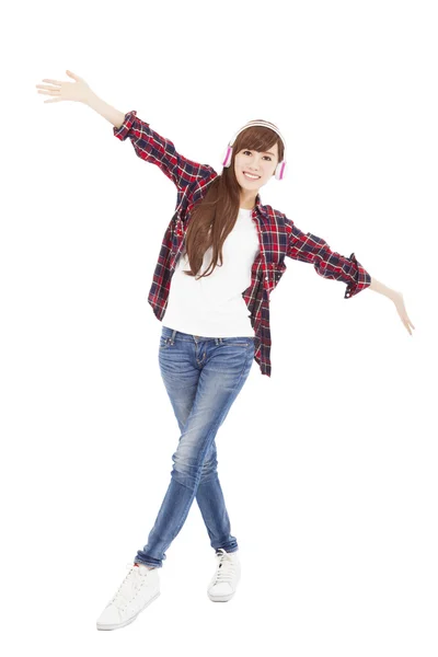 Young woman with headphones listening music and dancing — Stock Photo, Image