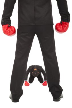 Businessman give up the competition with boxing gloves clipart