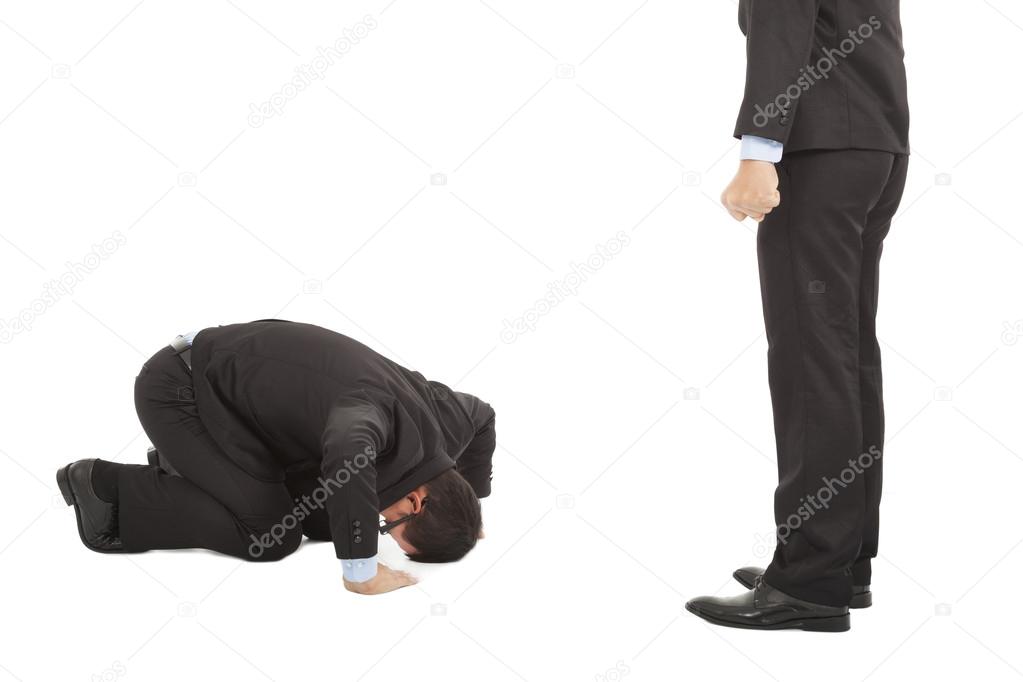 Businessman apologize to boss with japanese kneeling position