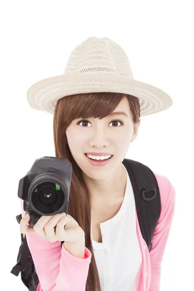 Smiling young woman holding a camera — Stock Photo, Image