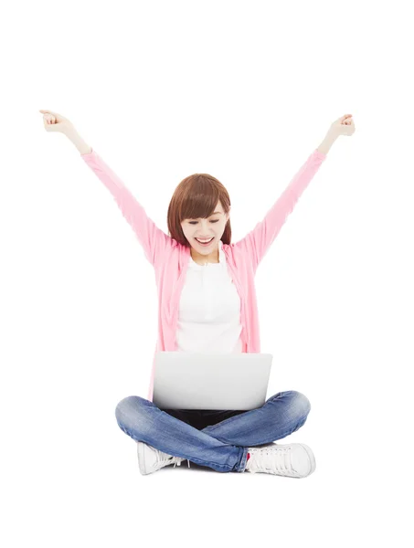 Young woman online on a laptop computer and arms up — Stock Photo, Image