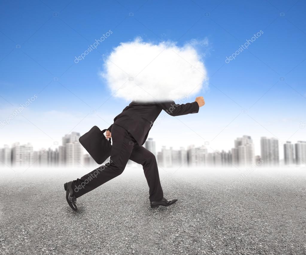 businessman running with head in the clouds in outdoors
