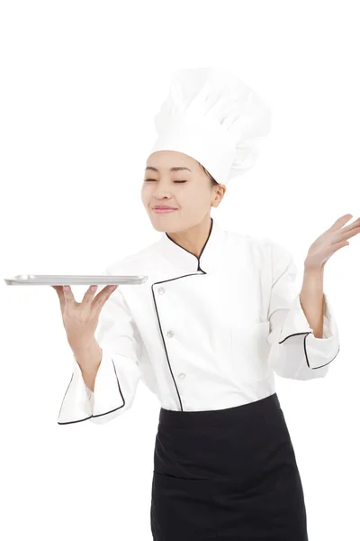 Chef holding tray and smelling something — Stock Photo, Image