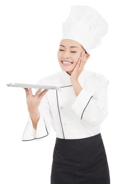 Satisfied woman chef holding tray — Stock Photo, Image