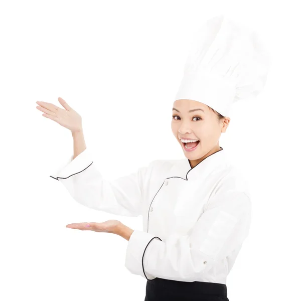 Unga graciösa kvinna klädd som en kock med mössa — Stockfoto
