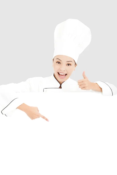 Young woman chef smiling and thumb up with blank board — Stock Photo, Image