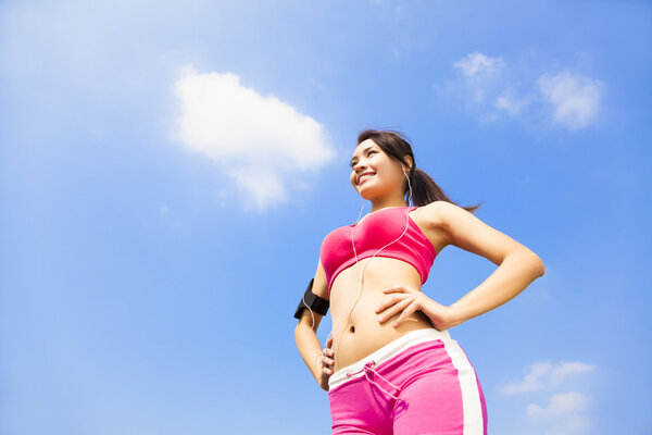 Beautiful Woman ready to start workout with music