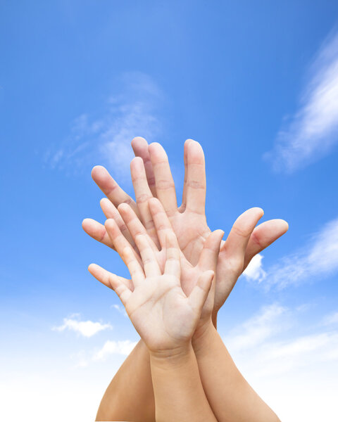 family united hands with blue sky and cloud