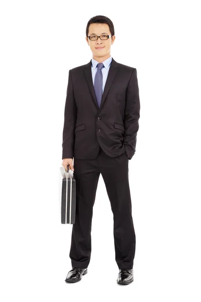 Success businessman holding briefcase over white background — Stock Photo, Image