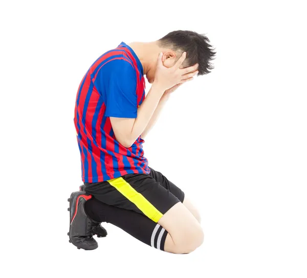 Flushed football player kneeling down — Stock Photo, Image