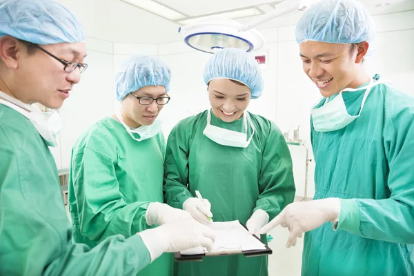 Happy Surgeons discussing success operating procedure — Stock Photo, Image