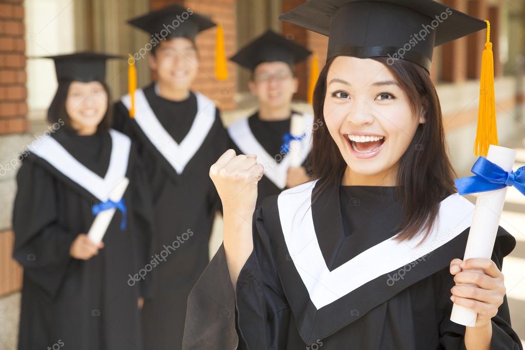 young college graduate holding diploma  and make a fist