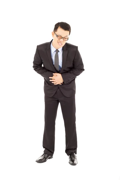 Businessman holding his stomach in pain — Stock Photo, Image