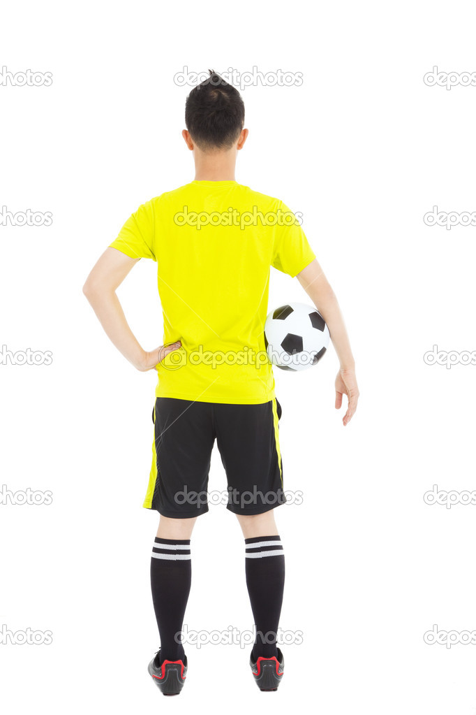 soccer player holding a soccer next to  waist