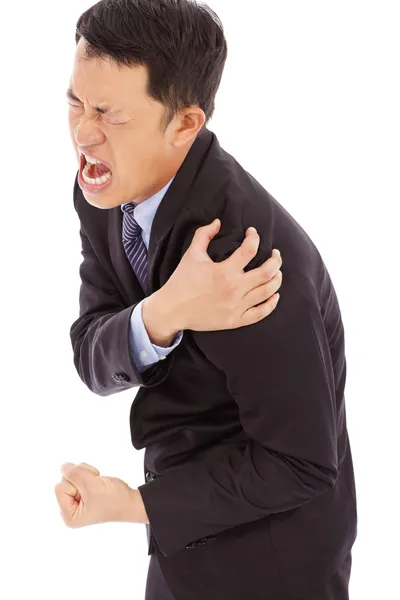 Businessman having shoulder pain and painful expression — Stock Photo, Image