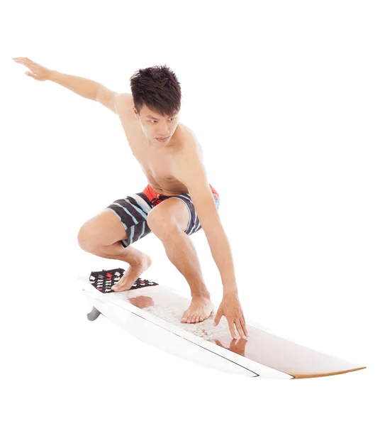 Joven surfista practica surf pose —  Fotos de Stock