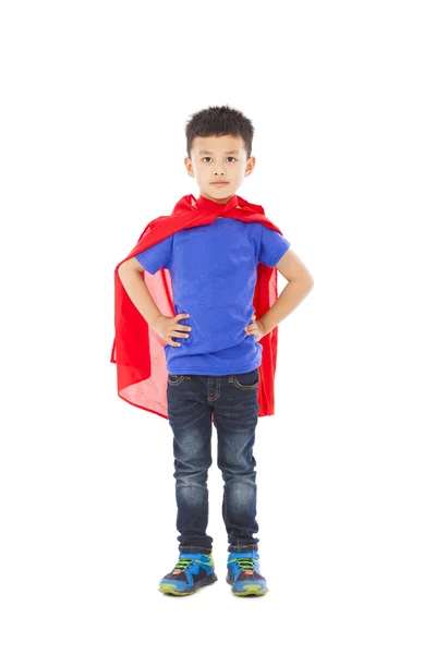 Sonriente superhéroe niño de pie sobre fondo blanco — Foto de Stock