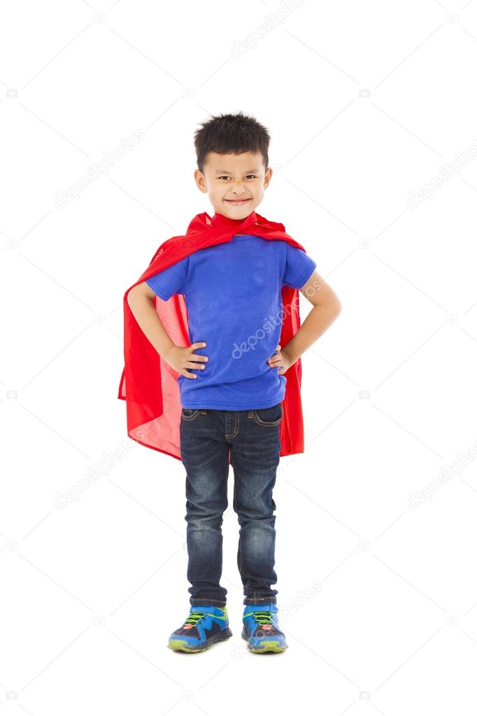 confident Superhero kid standing in studio