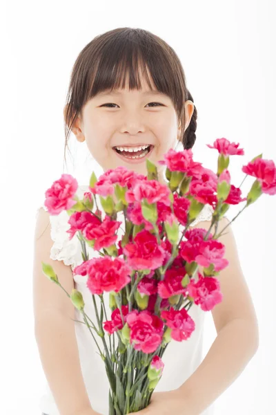 Close up of happy little girl holding  a bouquet of carnations — Stock Photo, Image