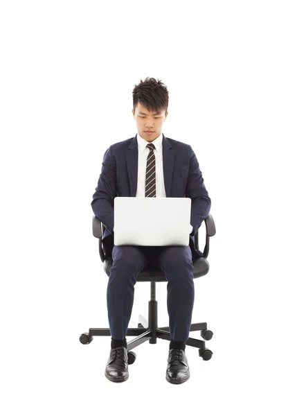 Businessman using laptop on the chair — Stock Photo, Image