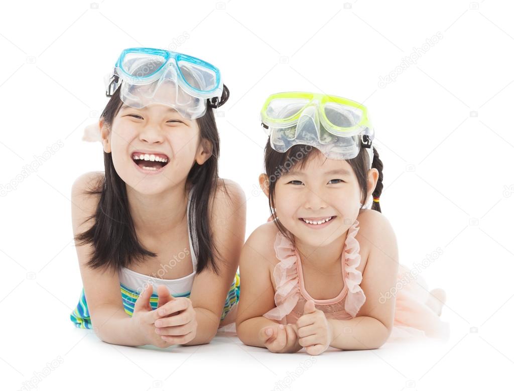 Happy little girls with swimsuit isolated on white