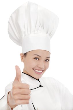 gülümseyen kadın aşçı, aşçı veya fırıncı başparmak gösterilen