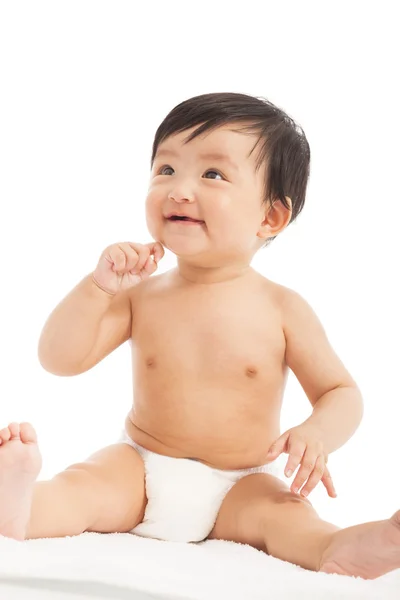 Uśmiechający się niemowlę dziecko dziecko siedzi i spójrz w górę — Zdjęcie stockowe