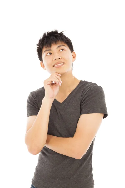 Joven sonriente pensando en un fondo blanco — Foto de Stock