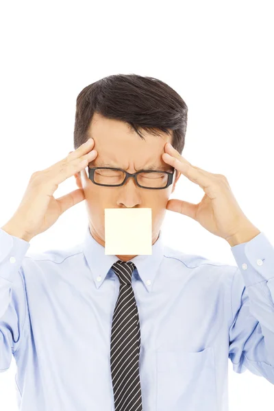 Hombre de negocios con dolor de cabeza expresión y pegatina —  Fotos de Stock