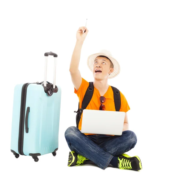 Happy young man sitting on the floor and raise a hand to draw — Stock Photo, Image