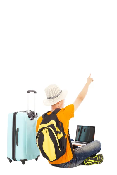 Young man sitting on the floor and  point direction — Stock Photo, Image