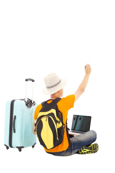 Young man sitting on the floor and raise a hand to draw — Stock Photo, Image