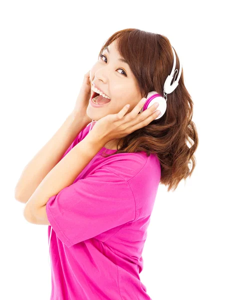 Happy young girl listening and holding the earphone — Stock Photo, Image