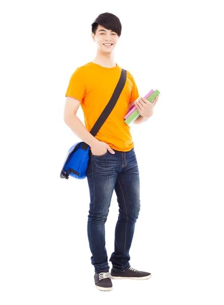 Joven estudiante sosteniendo libros y mochila inclinada —  Fotos de Stock