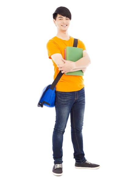 Joven estudiante sosteniendo libros y mochila inclinada — Foto de Stock