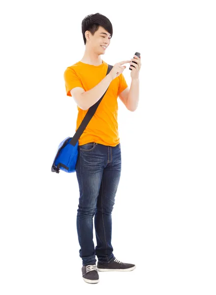 Junge Studentin berührt ein Smartphone mit weißem Hintergrund — Stockfoto