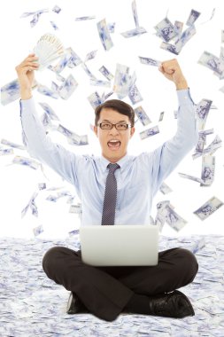 Business man holding money  and raising hands clipart
