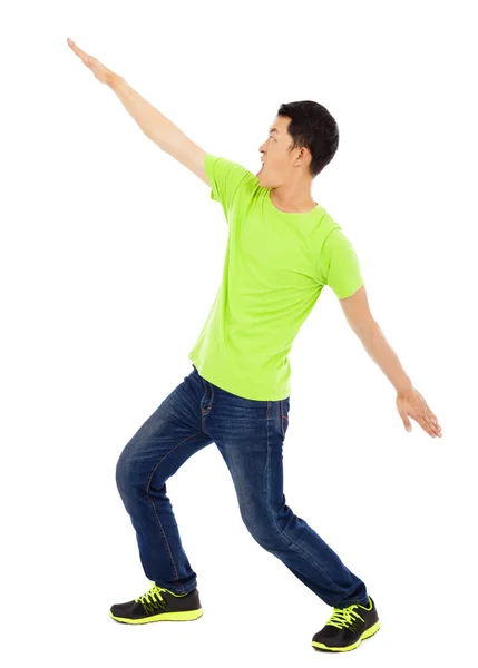 Young happy man raise hand and funny pose — Stock Photo, Image